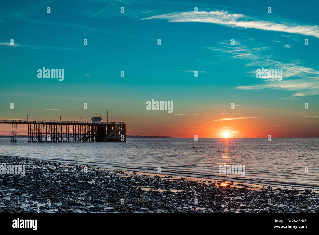 Summer sunrise over Bristol Channel with Penarth Pier. Stock Photo