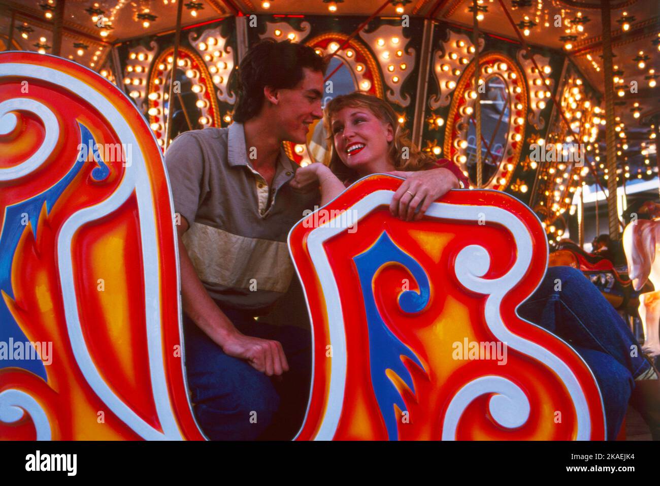 Young couple on ride at funfair. Luna Park. Sydney. Stock Photo
