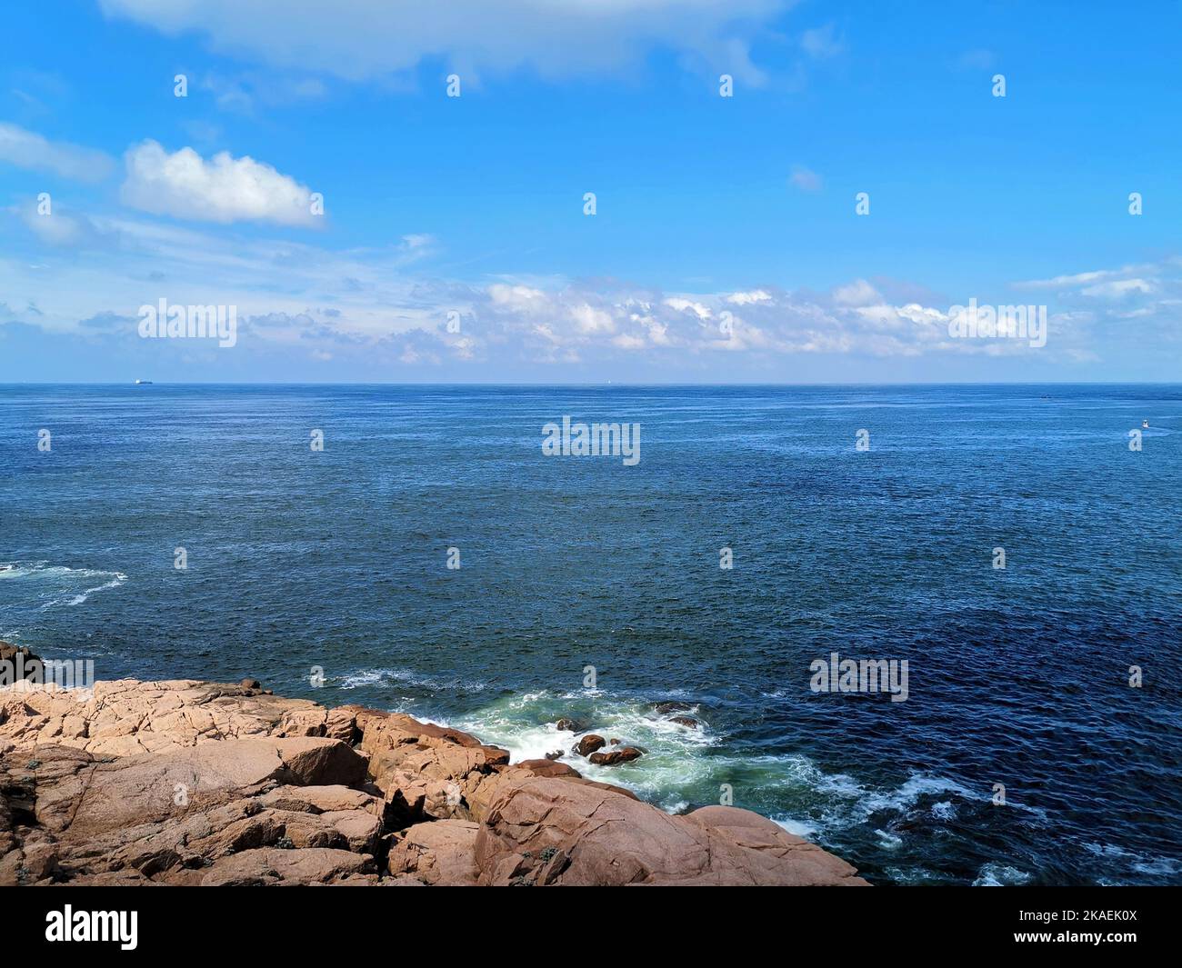 A beautiful seascape with rocks in the foreground Stock Photo - Alamy