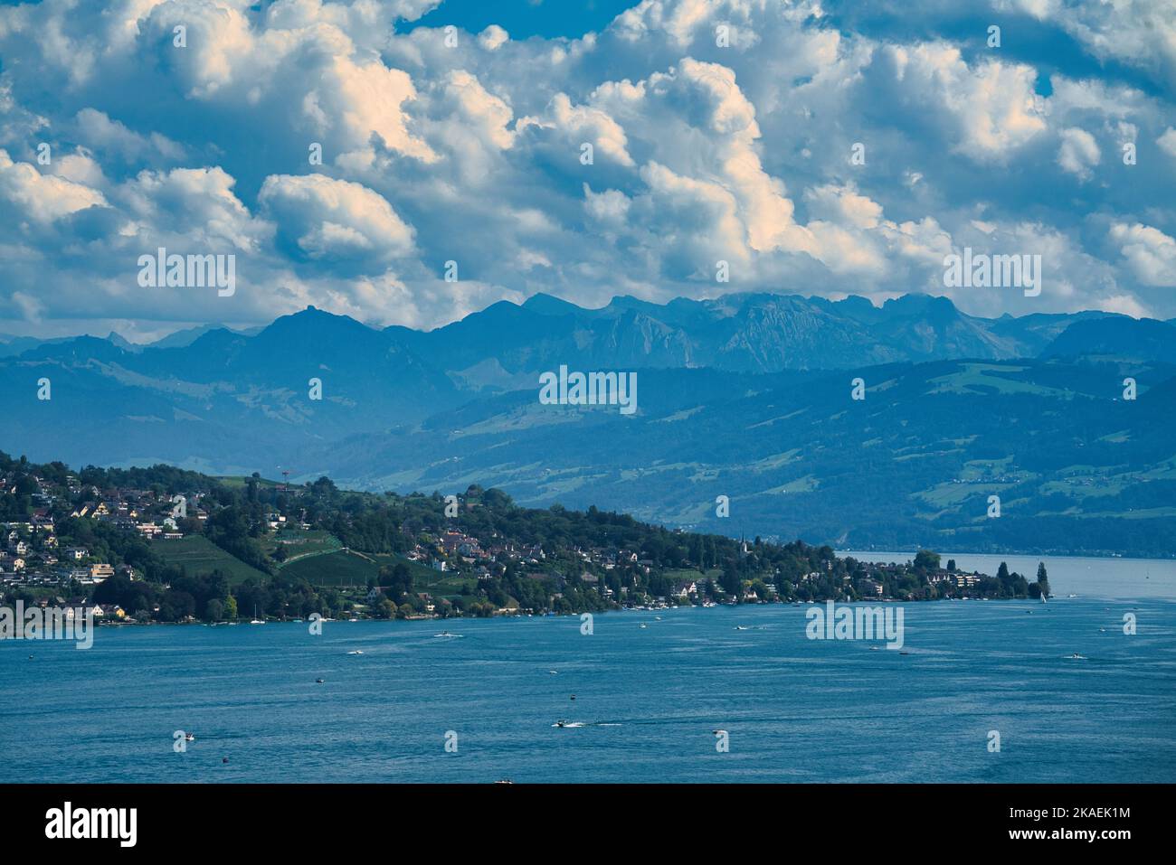 A beautiful view of Lake Zurich with mountains in the background in Meilen, Switzerland Stock Photo