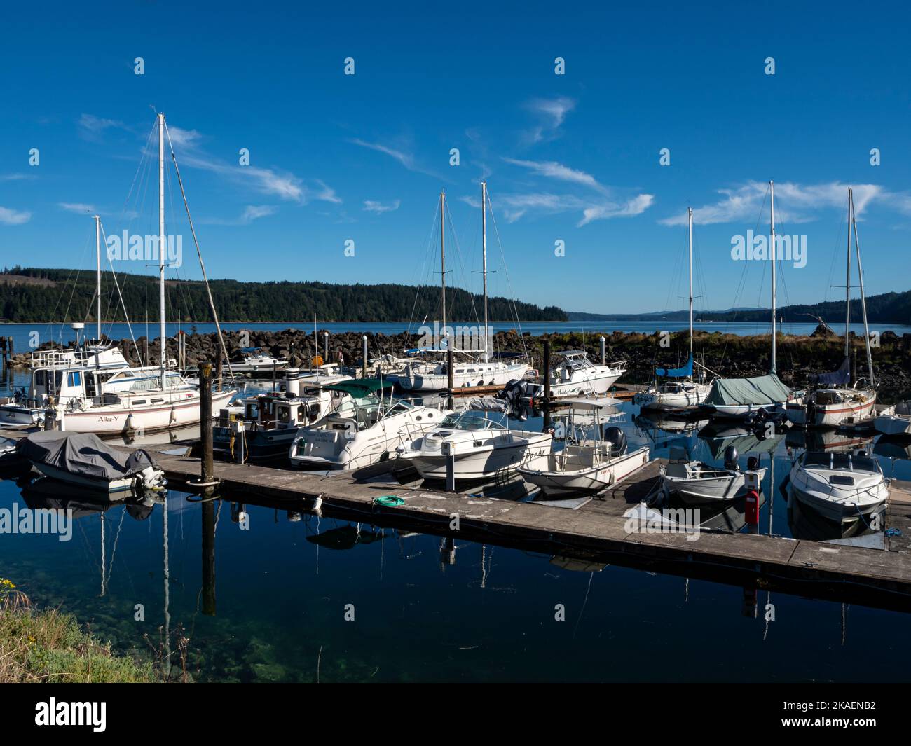 WA22659-00...WASHINGTON - Boats moored at Herb Beck Marina located off the Hood Canal on Quilcene Bay near the town of Quilcene. Stock Photo