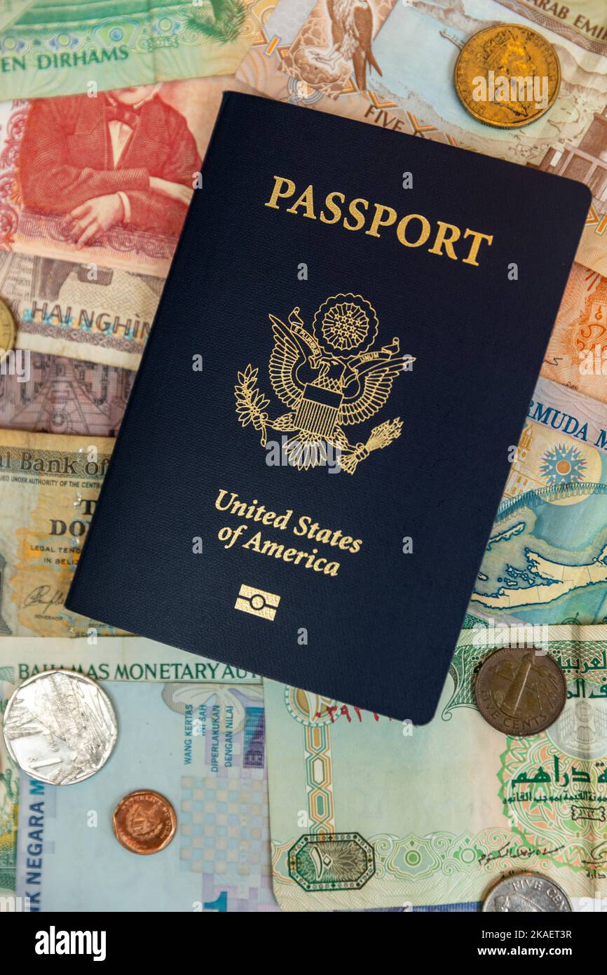 US passport and foreign paper currency Stock Photo