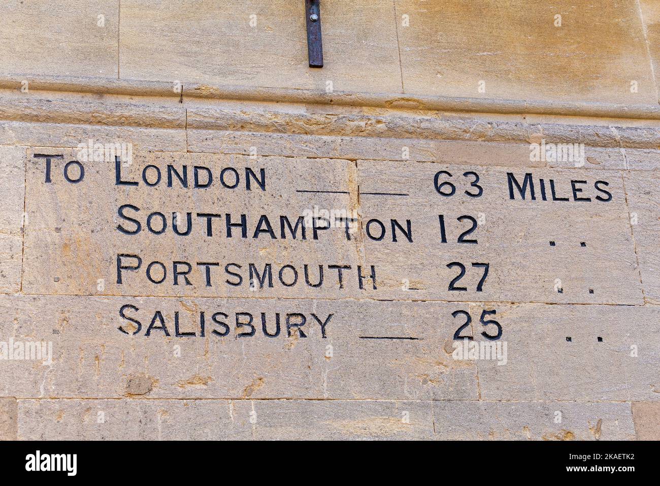 Distances to cities written to a wall, Winchester, Hampshire,England, Great Britain Stock Photo