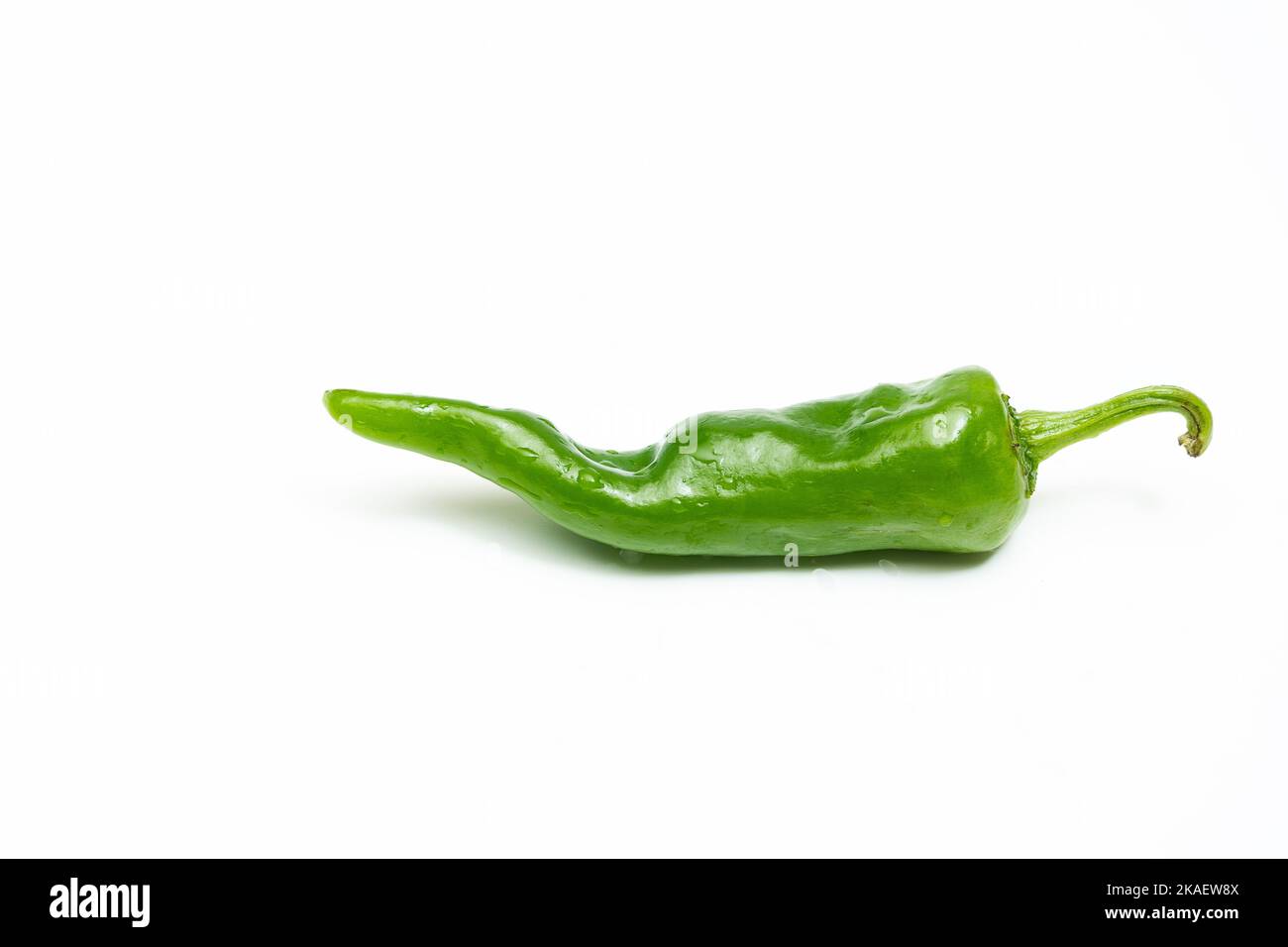 A green chili pepper isolated on white background Stock Photo - Alamy
