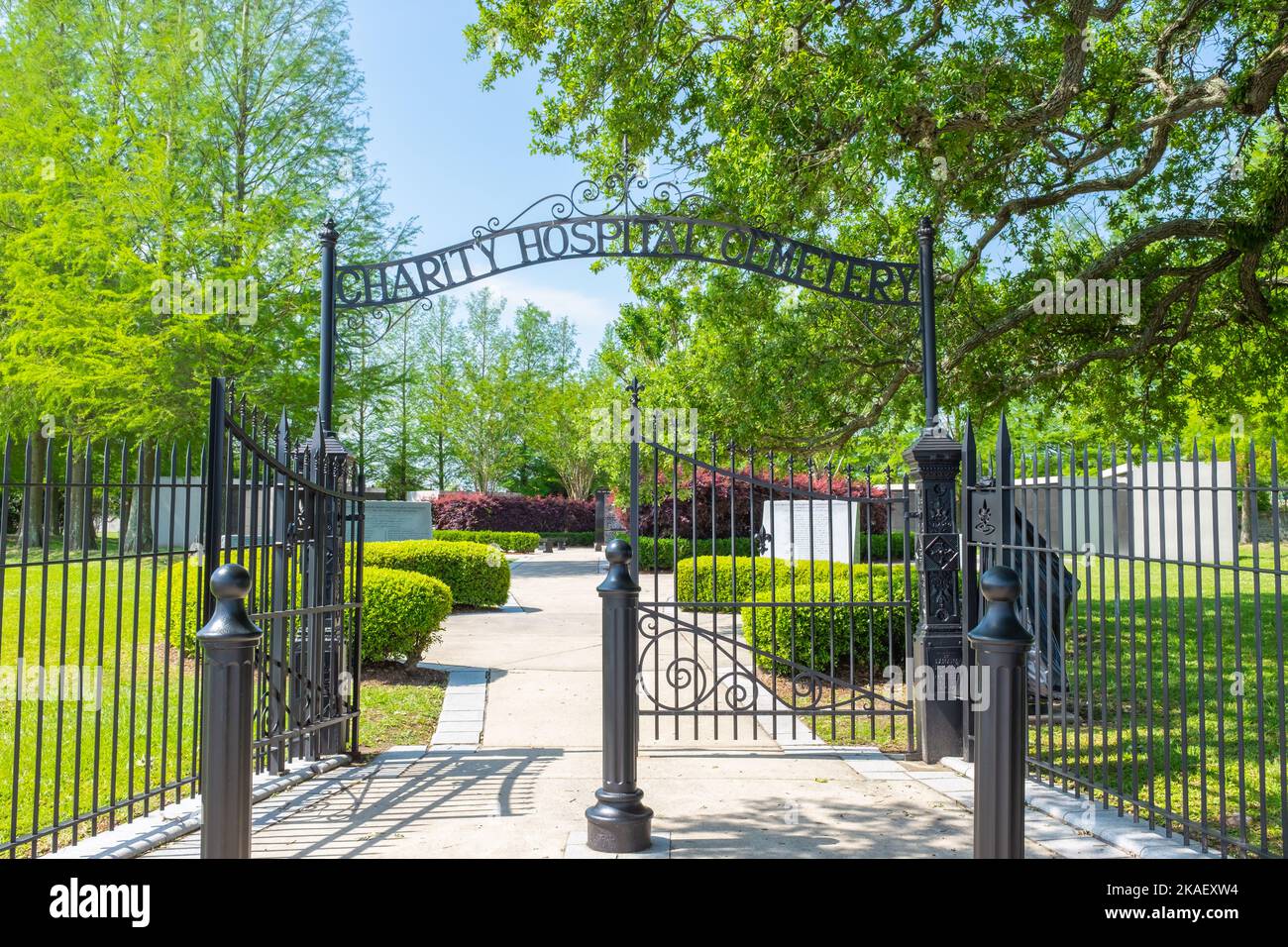 NEW ORLEANS, LA, USA - APRIL 11, 2021: Front wrought iron gate to Charity Hospital Cemetery on Canal Street Stock Photo