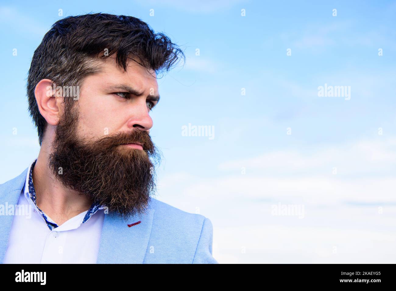 Man bearded hipster with mustache blue sky background. Ultimate mustache grooming guide. Expert