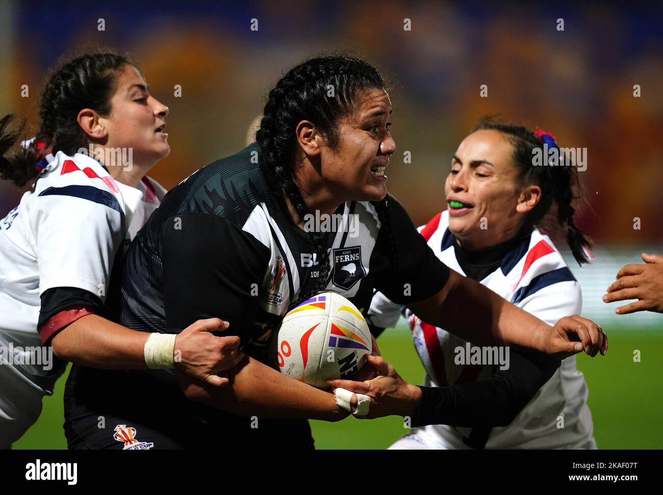 New Zealand's Amber Hill is tackled by France's Elisa Ciria and Alice Varela during the Women's Rugby League World Cup group B match at the LNER Community Stadium, York. Picture date: Wednesday November 2, 2022. Stock Photo