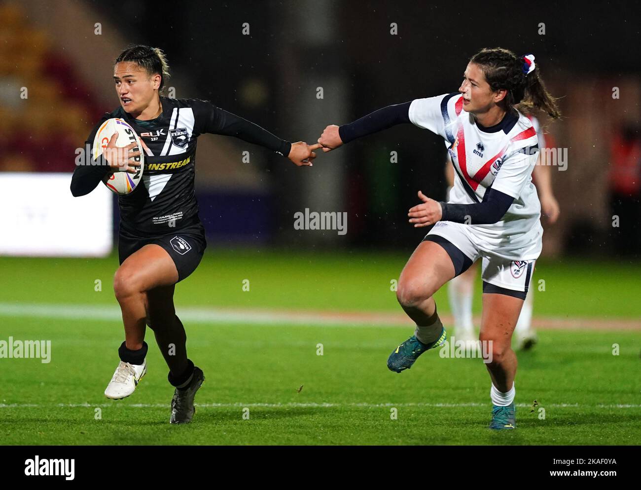 New Zealand's Nita Maynard is tackled by France's Manon Samarra during the Women's Rugby League World Cup group B match at the LNER Community Stadium, York. Picture date: Wednesday November 2, 2022. Stock Photo