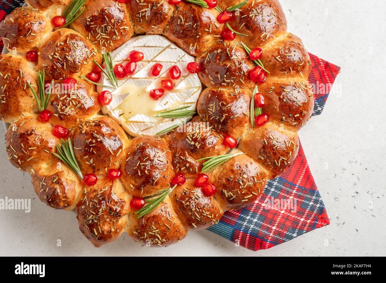 Bread Christmas wreath with cheese topped with rosemary and pomegranate Stock Photo Alamy