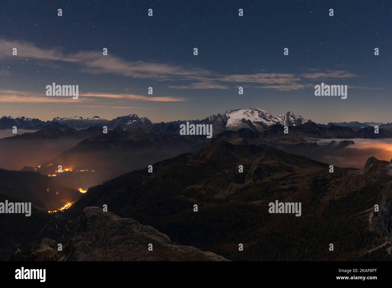 Dawn on the summit of the small Lagazuoi with the panorama of the Dolomites and peaks of the Marmolada, Monte Civetta, Col di Lana, Sass di Stria. Stock Photo