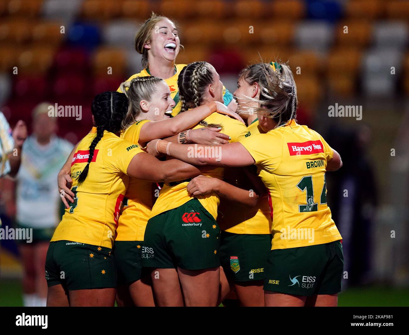 Australia’s Caitlan Johnston celebrates scoring a try with teammates during the Women's Rugby