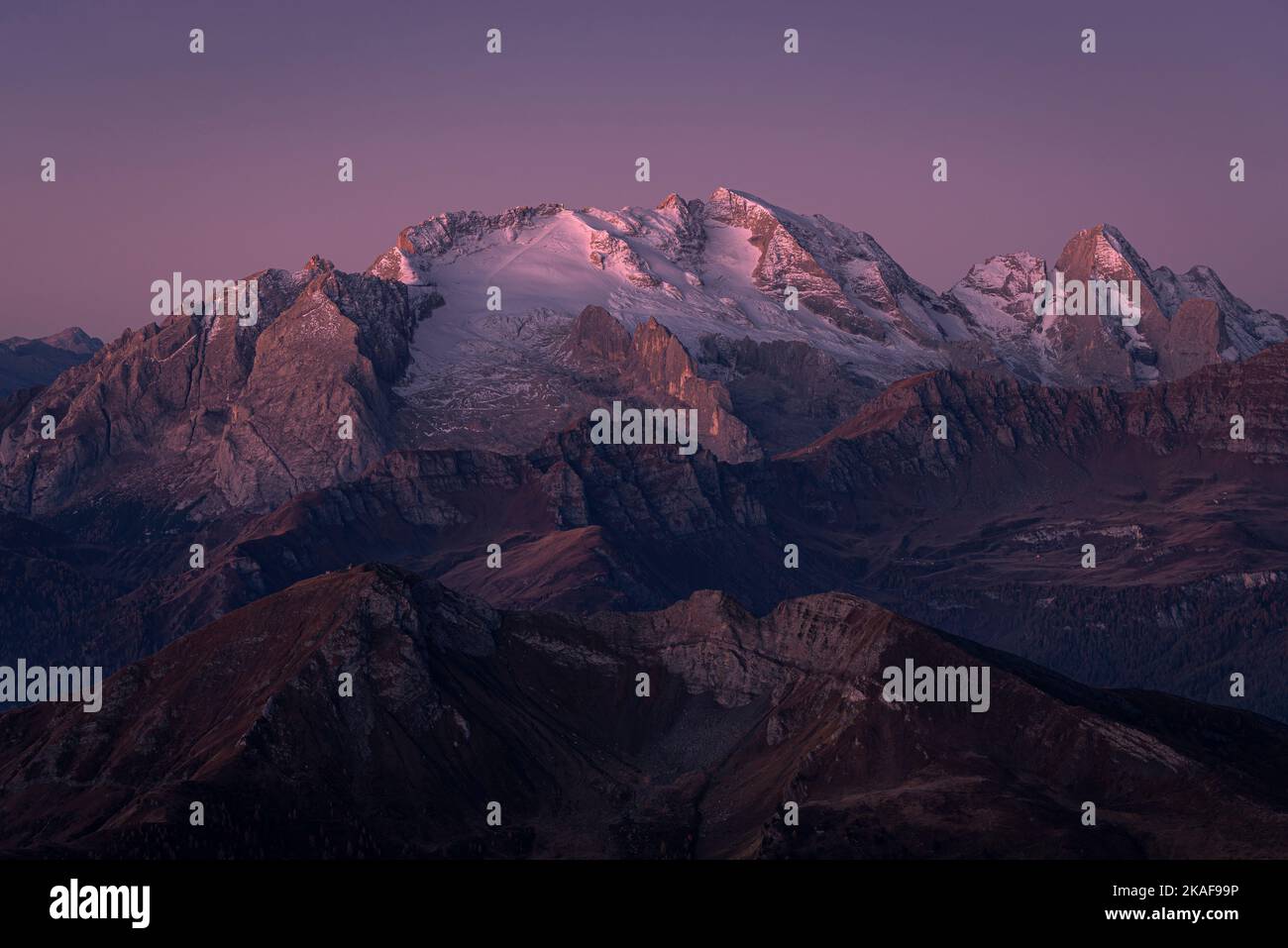 Colourful dawn at the peak of the Marmolada mountain massif in autumn, Dolomites, Italy Stock Photo