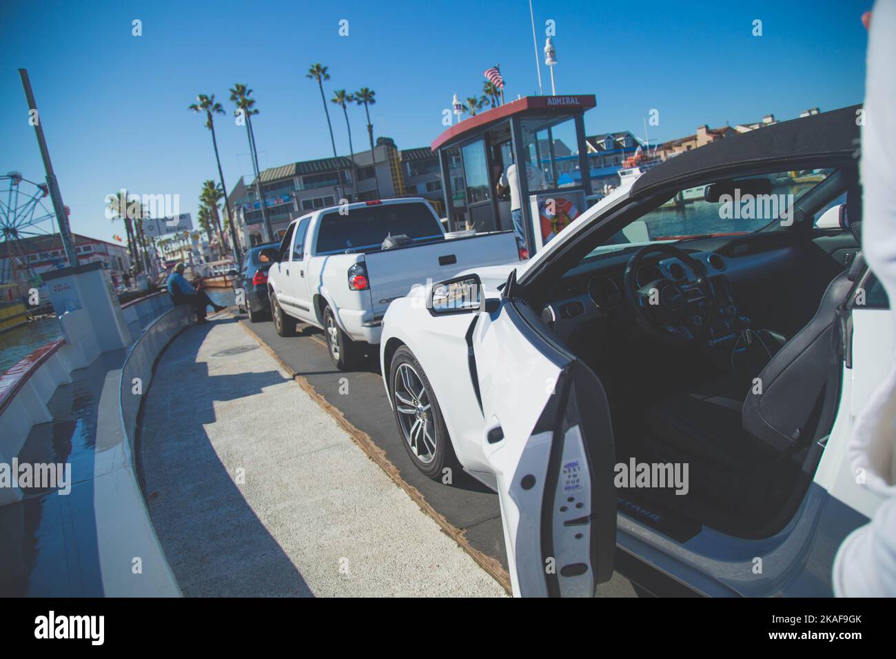Parked cars waiting for a ferry ride on Balboa Island to the beach in Newport beach in Southern