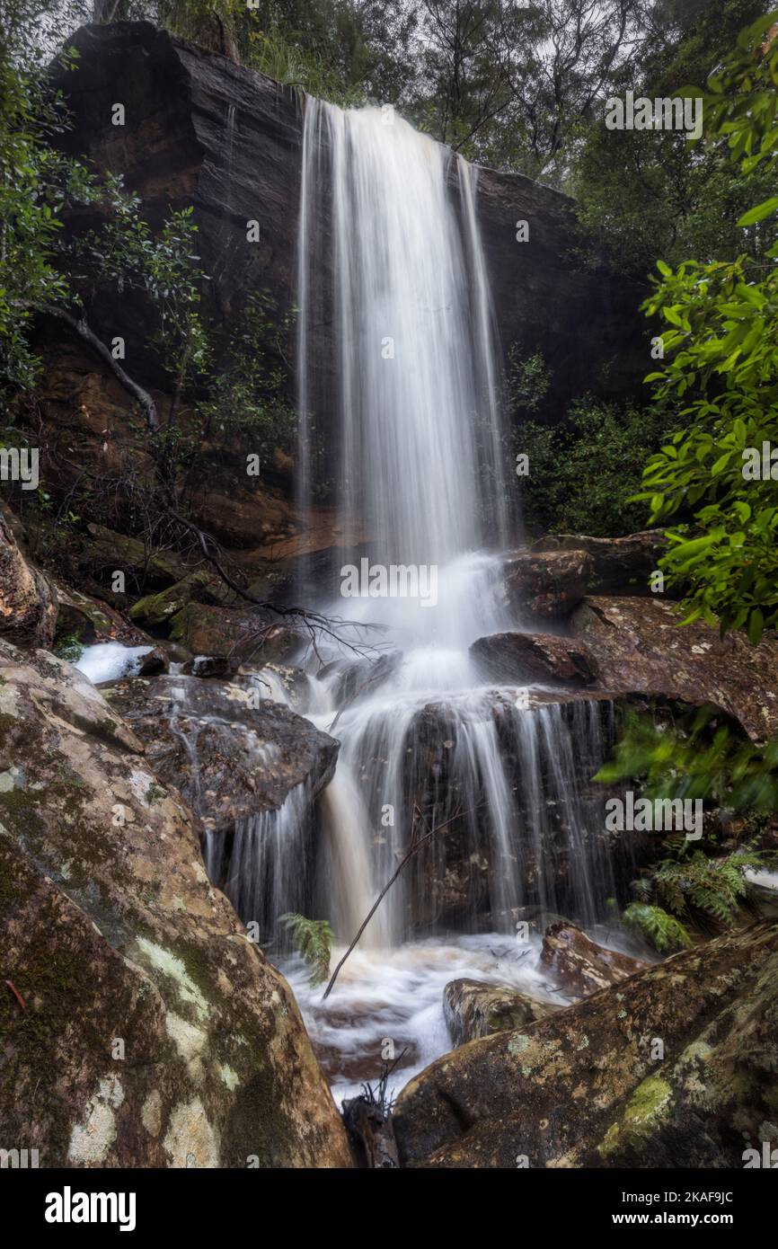 A vertical shot of the Waterfall in bushland in Brisbane Water National Park at Koolewong on NSW Central Coast in Australia Stock Photo