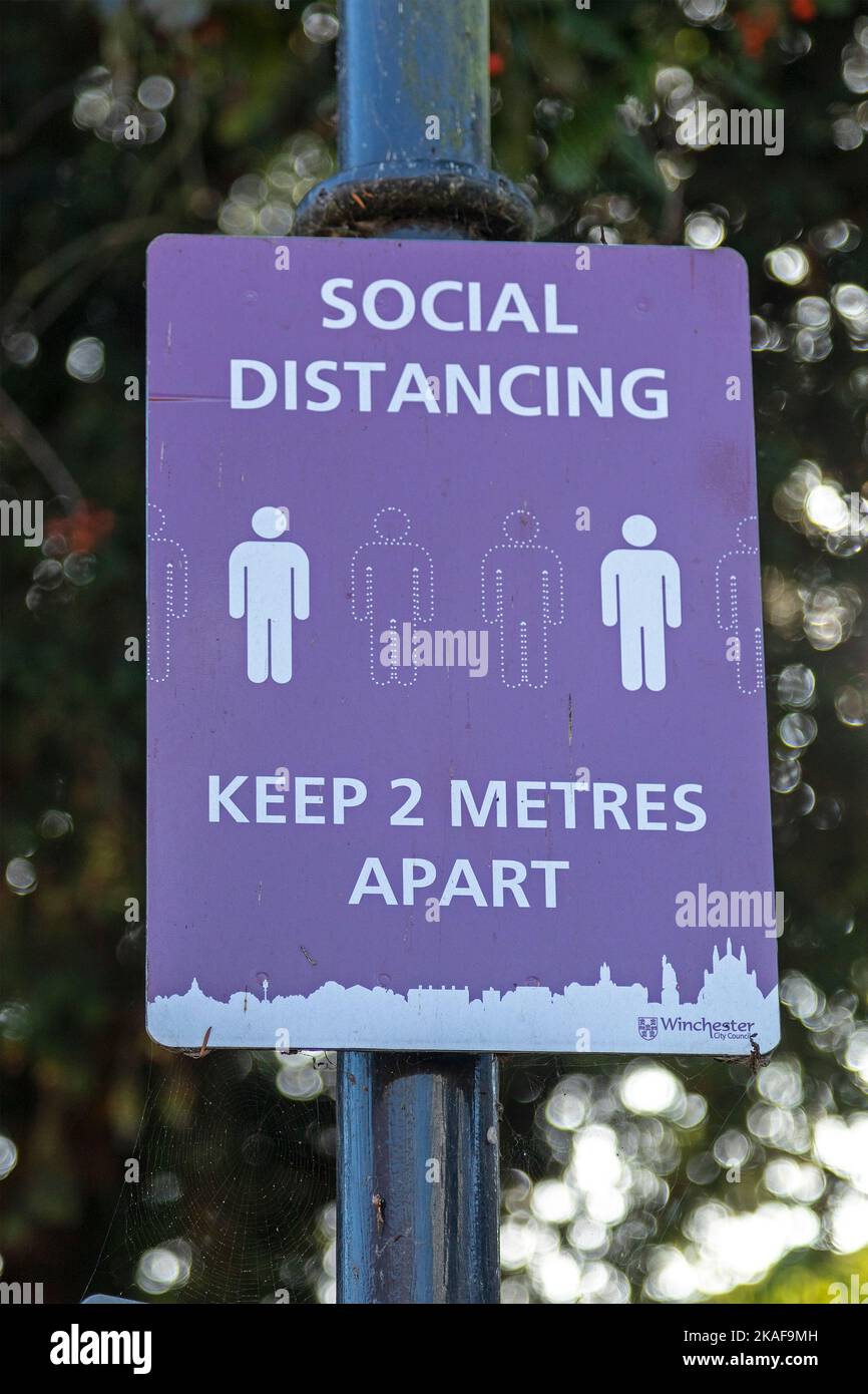 Sign reminding of social distancing, Corona, Winchester, Hampshire ...