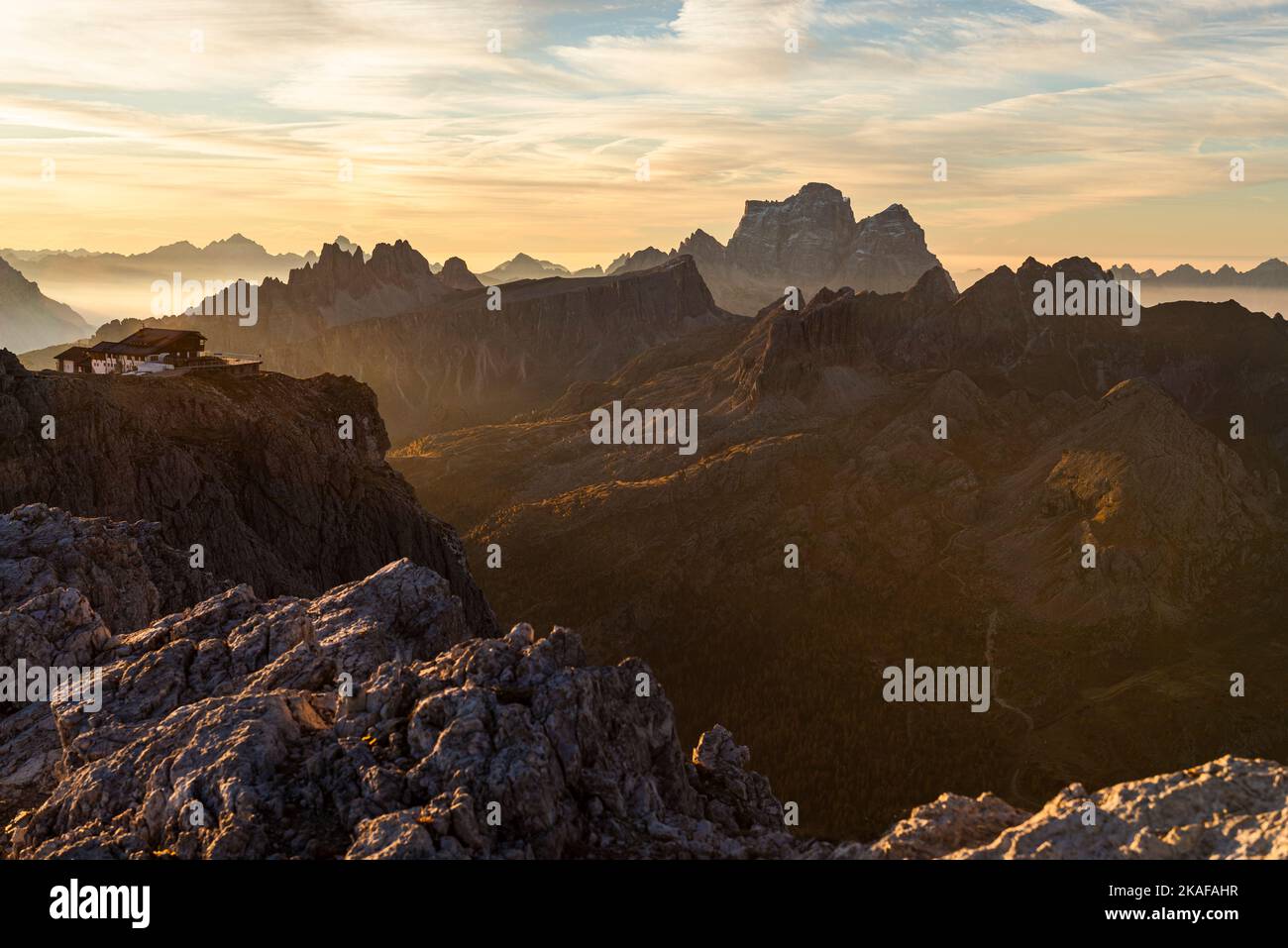 Sunrise on the summit of the small Lagazuoi with the panorama of the Dolomites and peaks of Monte Pelmo, Novolau, Averau, Italy Stock Photo