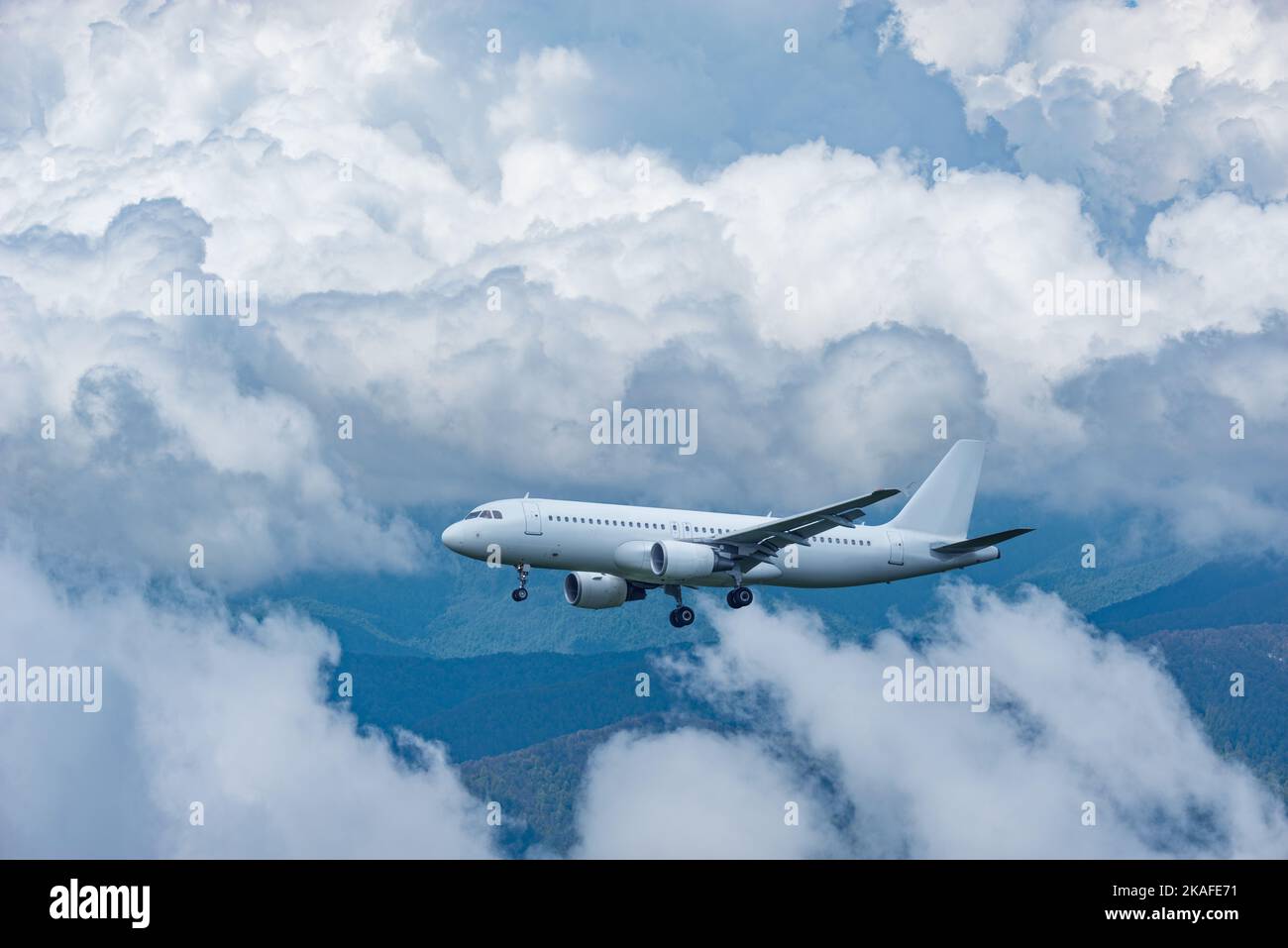 Flight of the passenger plane above the clouds Stock Photo - Alamy
