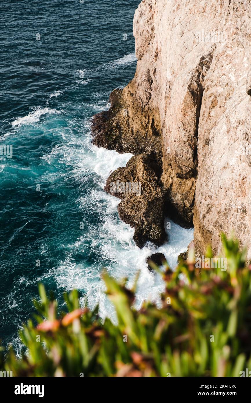 A vertical shot of the scenic Cape St. Vincent cliff in Portugal with ...