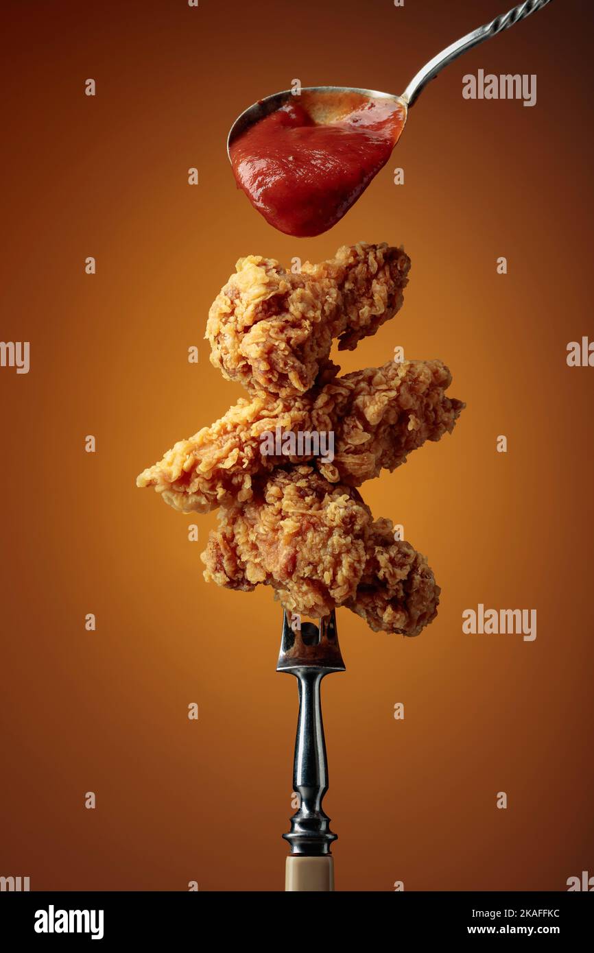 Delicious crispy fried chicken with tomato sauce. Fried chicken with