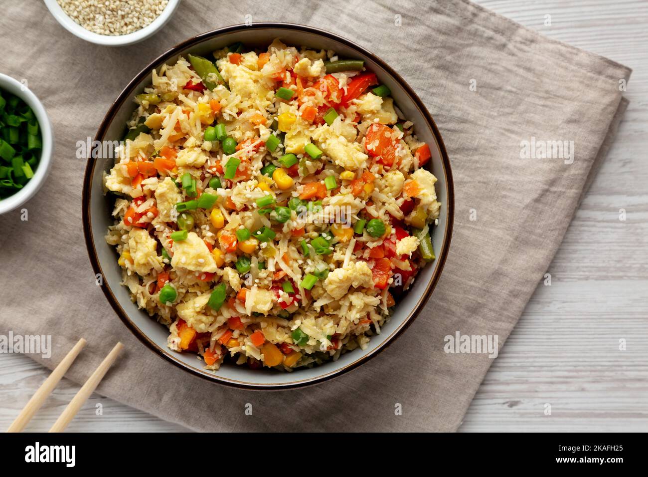 Homemade Cauliflower Fried Rice with Chives and Sesame Seeds in a Bowl ...