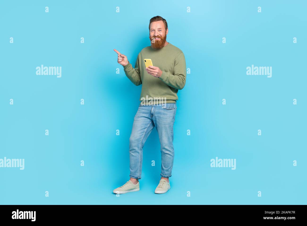 Man showing smartphone full body hi-res stock photography and images ...