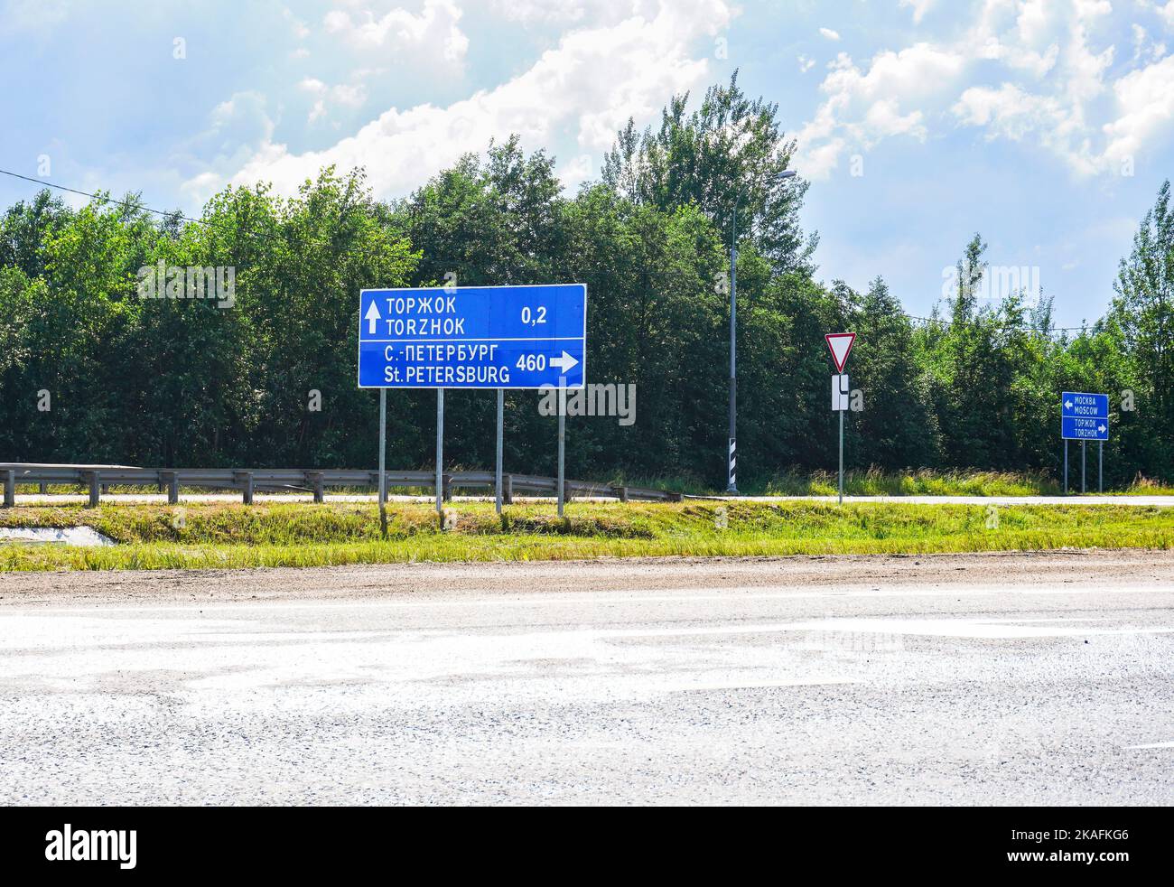Russian m10 highway with signs and exits in summer Stock Photo
