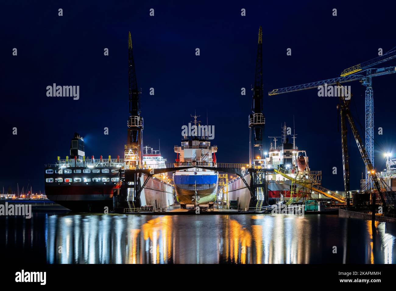 general cargo vessel in floating dock for maintenance at night Stock Photo Alamy