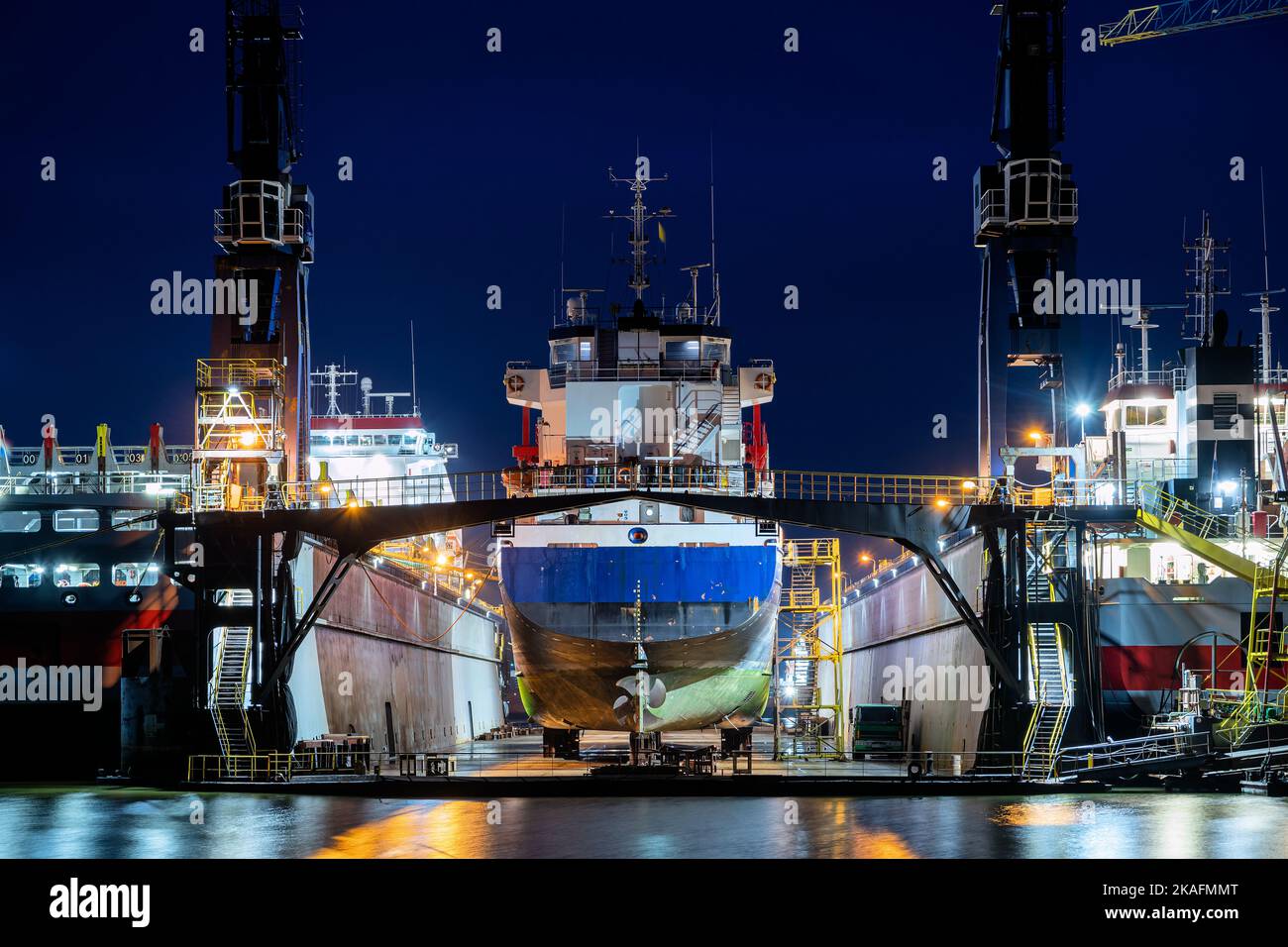 general cargo vessel in floating dock for maintenance at night Stock Photo Alamy