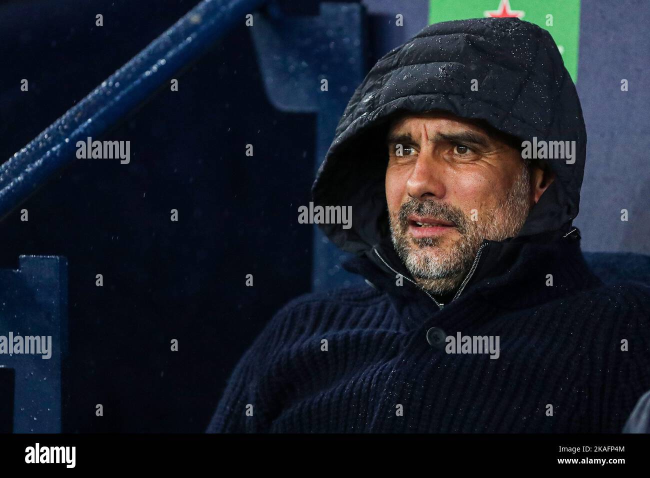 Manchester, UK. 02nd Nov, 2022. Pep Guardiola of Manchester City sits with his hood on during the UEFA Champions League match between Manchester City and Sevilla at the Etihad Stadium, Manchester, England on 2 November 2022. Photo by Ben Wright. Editorial use only, license required for commercial use. No use in betting, games or a single club/league/player publications. Credit: UK Sports Pics Ltd/Alamy Live News Stock Photo