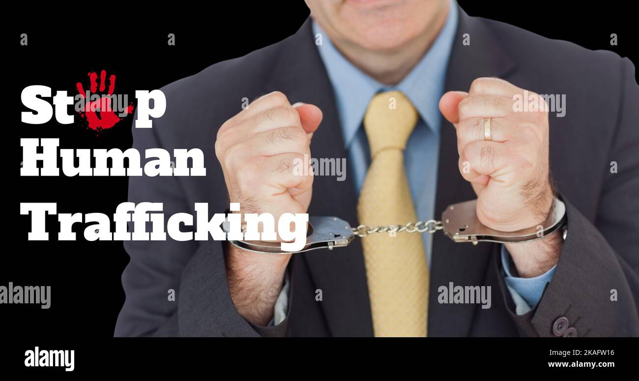 Composite of close-up of caucasian businessman with handcuffs and stop human trafficking text Stock Photo