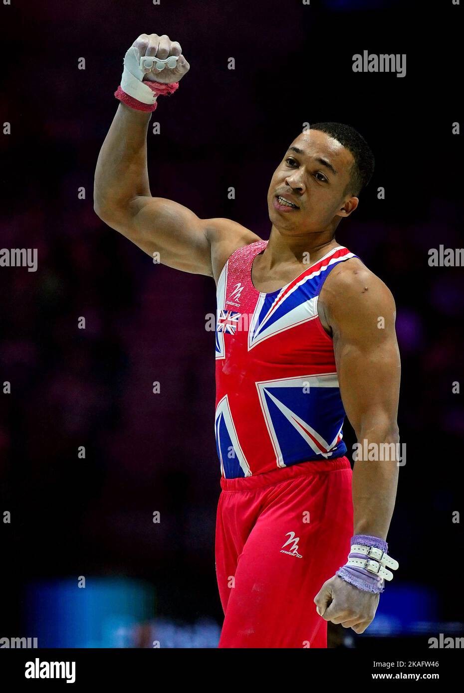 Great Britain's Joe Fraser punches the air after his high bar routine