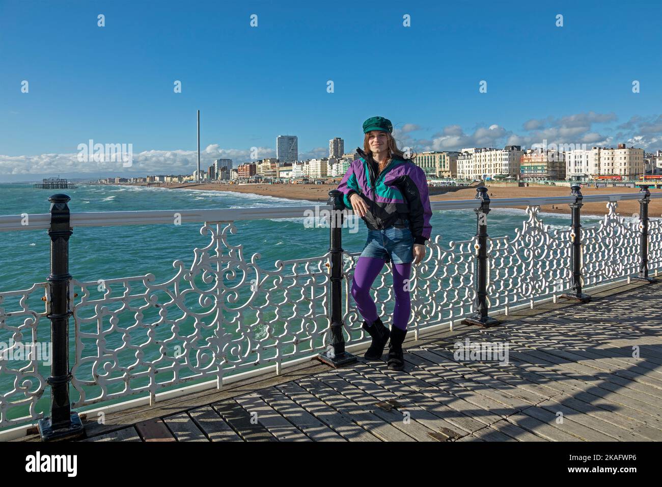 Colourfully dressed teenage boy, Palace Pier, Brigthon, England, Great Britain Stock Photo
