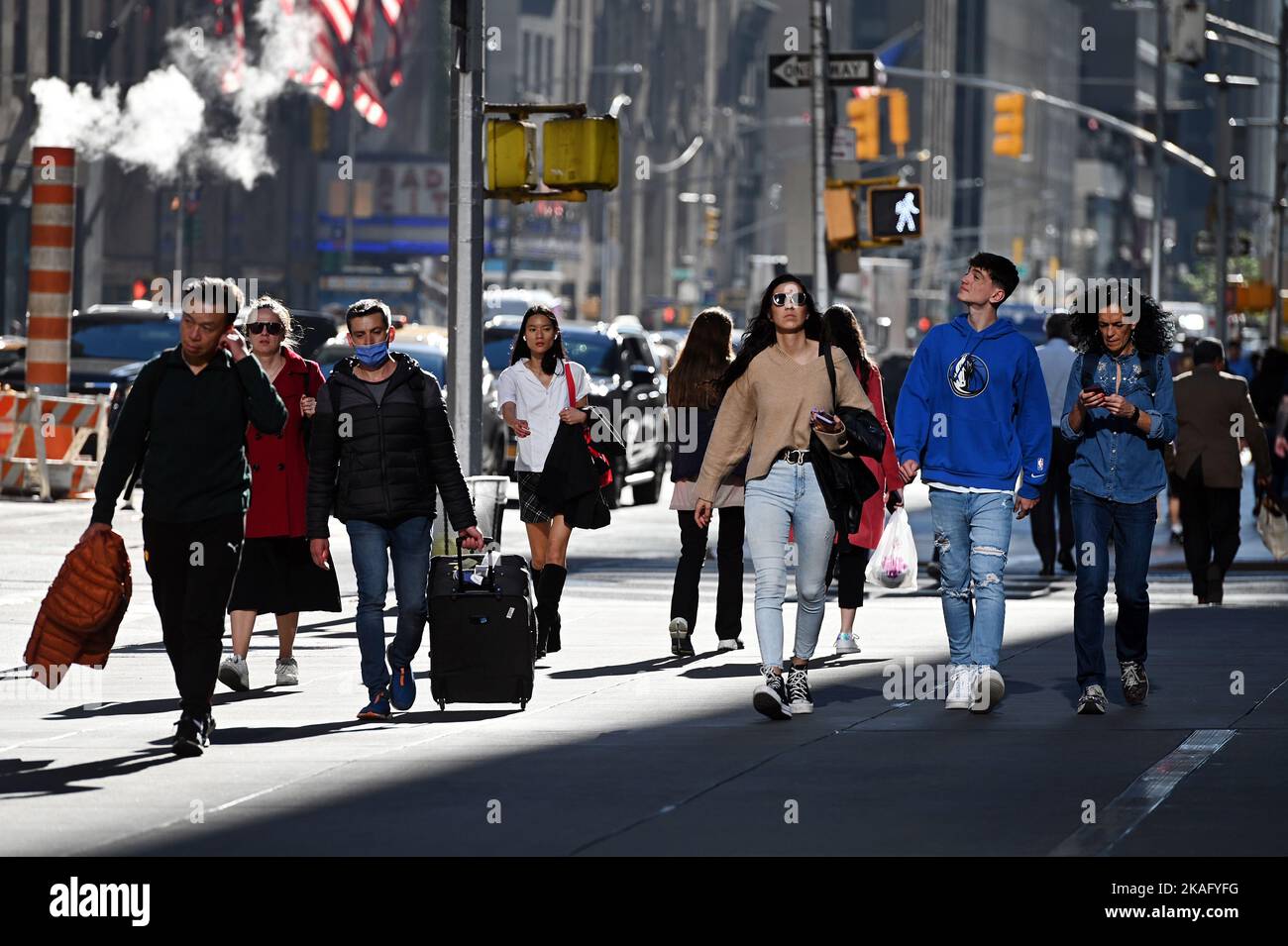 New York, USA. 02nd Nov, 2022. People walking along 6th Avenue wearing