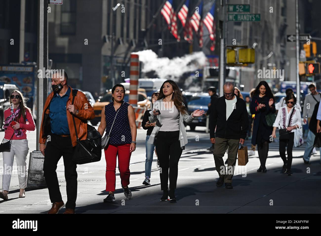 New York, USA. 02nd Nov, 2022. People walking along 6th Avenue wearing