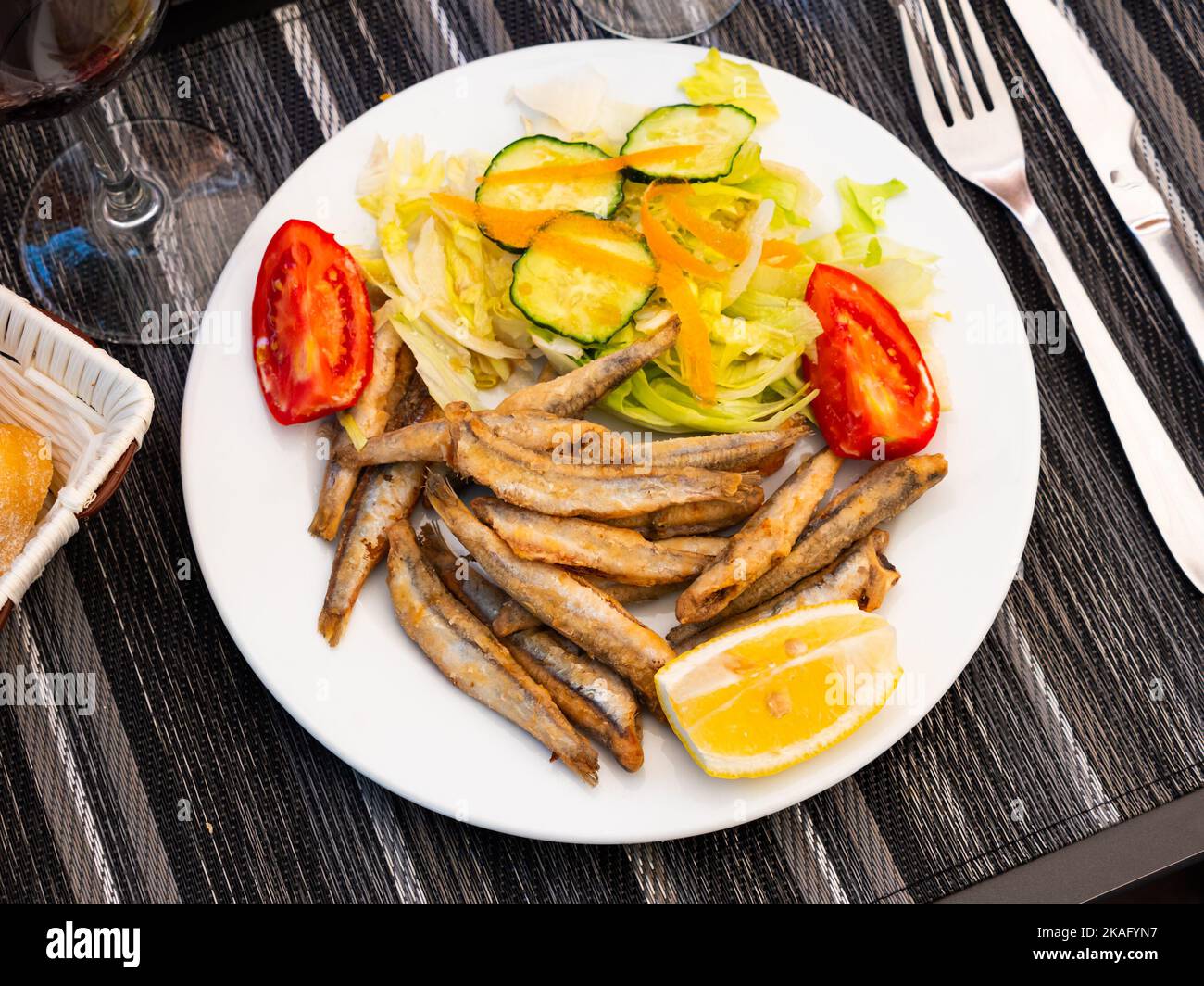 Appetizer cooked anchovies with vegetable garnish Stock Photo Alamy
