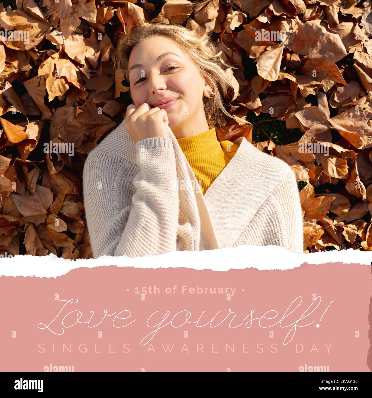 Composition of singles awareness day text and smiling caucasian woman lying on leafy background Stock Photo