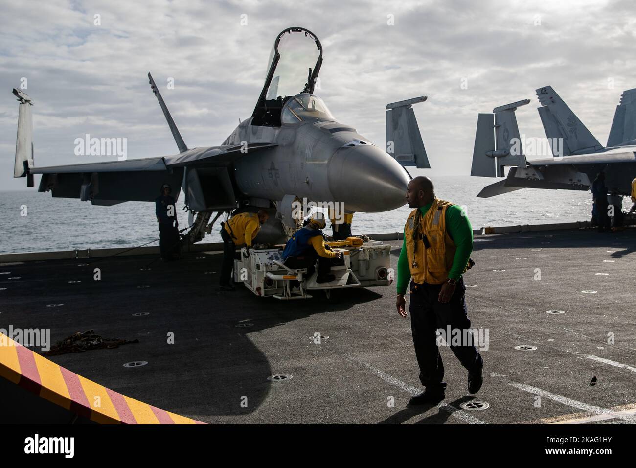 Sailors assigned to the 'Golden Warriors' of Strike Fighter Squadron (VFA) 87, move F/A-18E Super Hornets to the first-in-class aircraft carrier USS Gerald R. Ford’s (CVN 78) hangar bay, Nov. 1, 2022. The Gerald R. Ford Carrier Strike Group (GRFCSG) is deployed in the Atlantic Ocean, conducting training and operations alongside NATO Allies and partners to enhance integration for future operations and demonstrate the U.S. Navy’s commitment to a peaceful, stable and conflict-free Atlantic region. (U.S. Navy photo by Mass Communication Specialist 3rd Class Grant Gorzocoski) Stock Photo