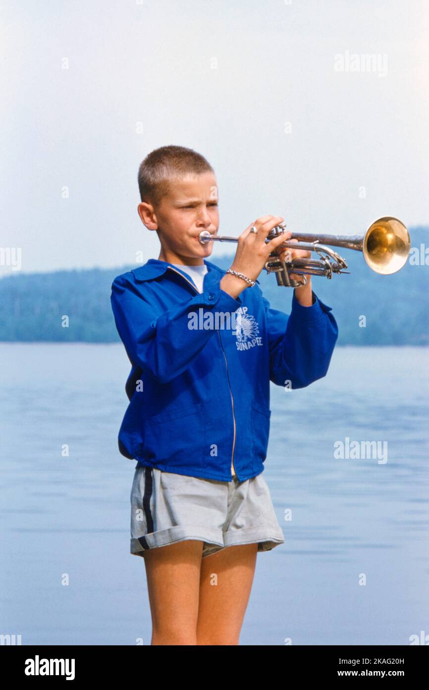 Boy playing Trumpet at Summer Camp, New Hampshire, USA, Toni Frissell