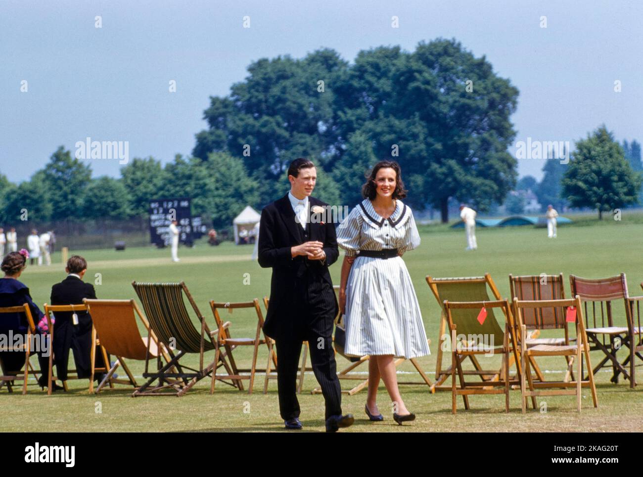 Teen Boy and Teen Girl attending Cricket Match, 'Fourth of June' event, Eton College, Eton, Berkshire, England, UK, Toni Frissell Collection, June 4, 1959 Stock Photo