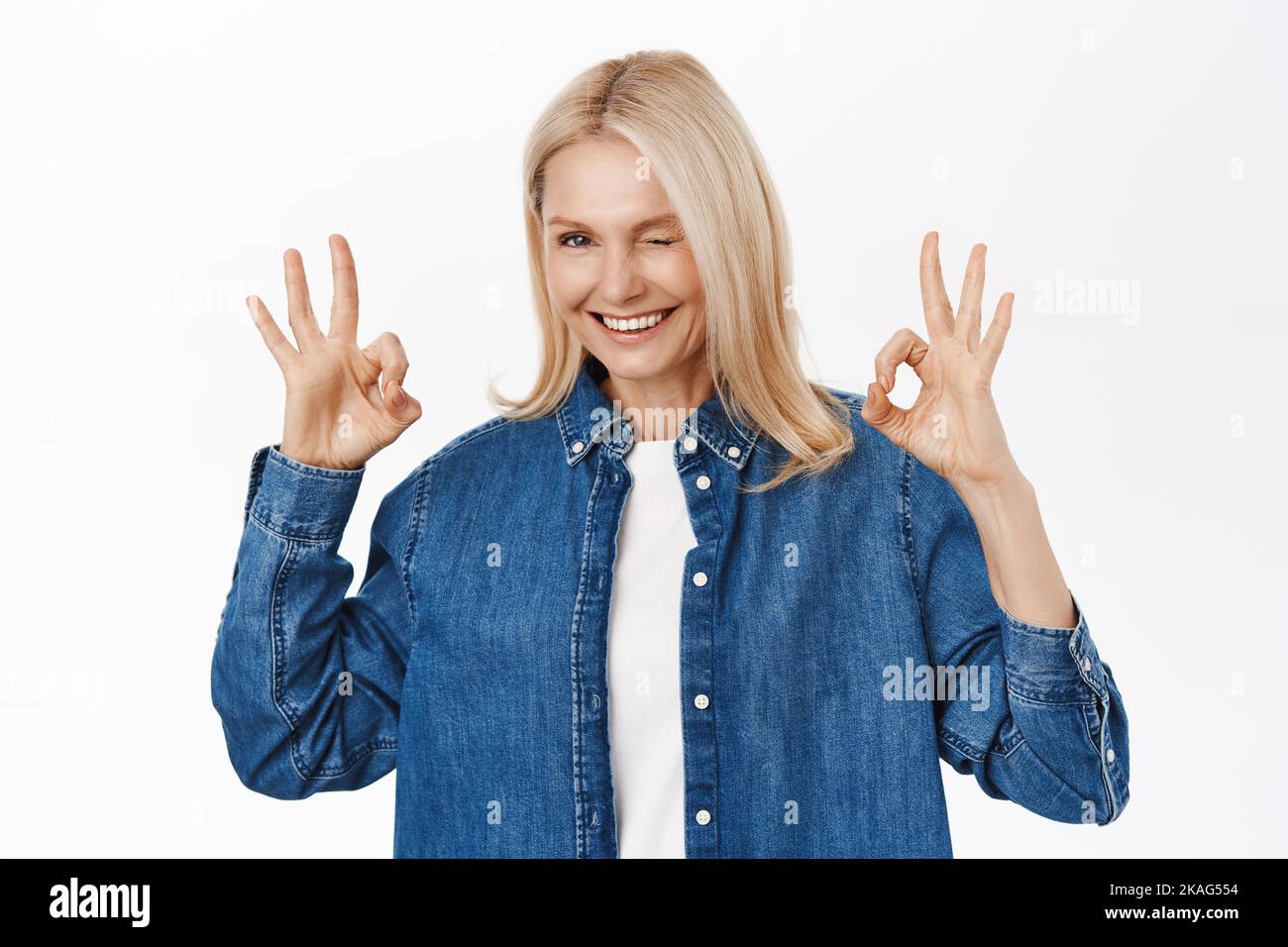 Beautiful senior woman, showing okay, ok sign, excellent gesture ...