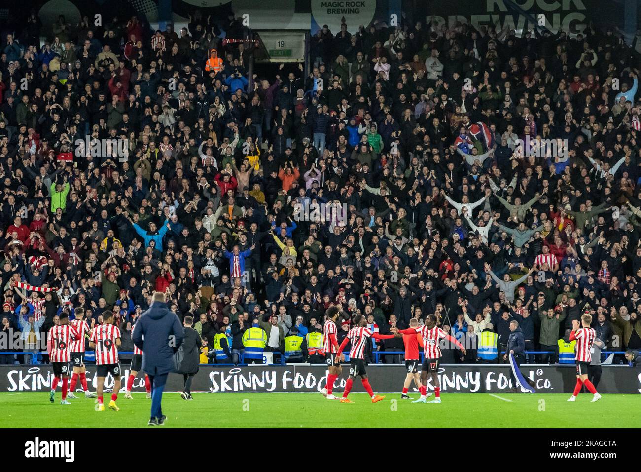 The travelling Sunderland fans cheer on their team after the Sky Bet Championship match Huddersfield Town vs Sunderland at John Smith's Stadium, Huddersfield, United Kingdom, 2nd November 2022  (Photo by James Heaton/News Images) Stock Photo