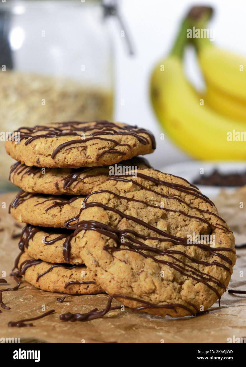 banana oatmeal cookies with chocolate chips, bananas in background Stock Photo Alamy
