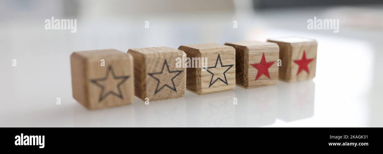Five stars rating wooden hi-res stock photography and images - Alamy