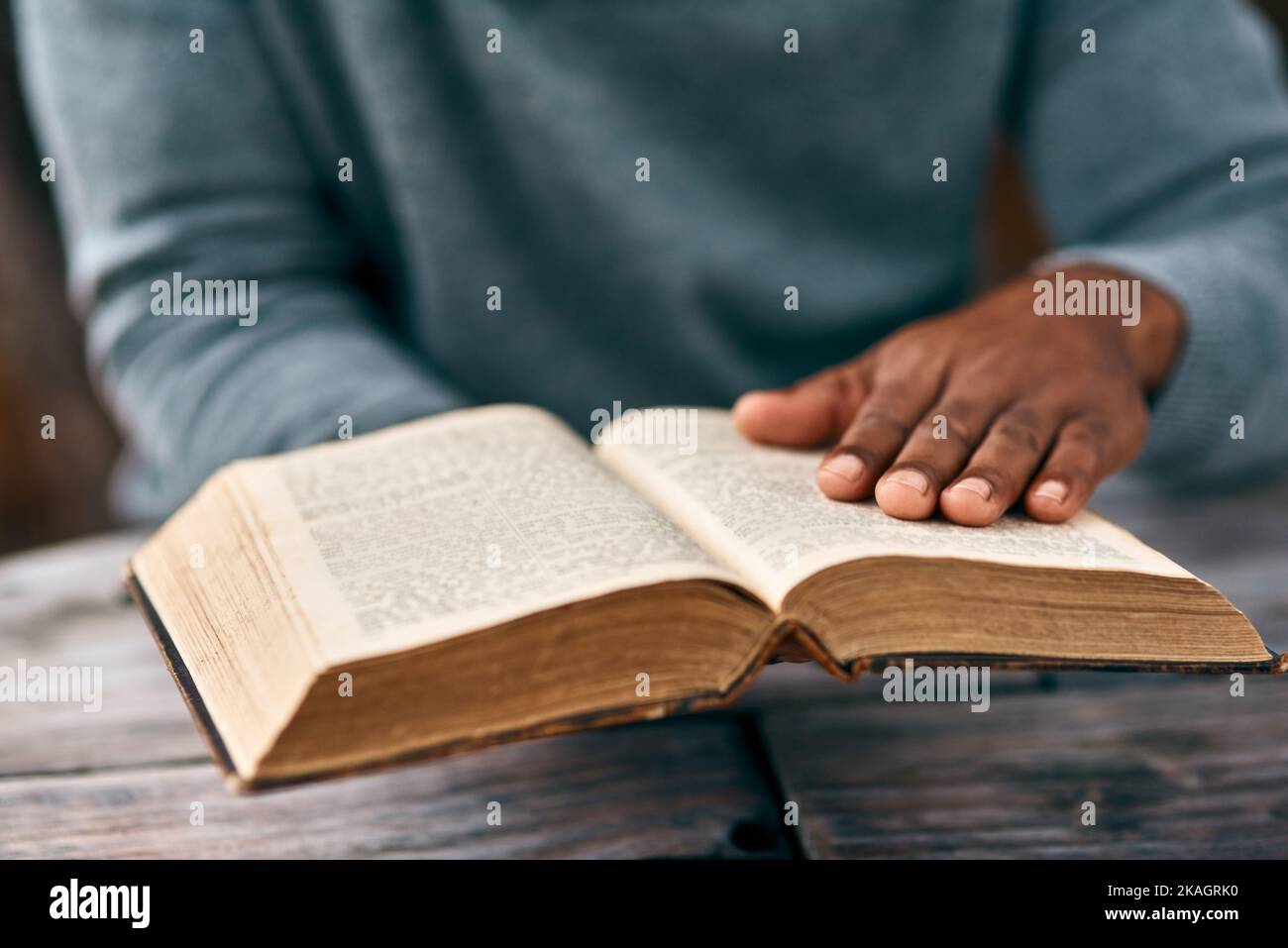 You cant keep a good book down. an unrecognizable man reading a book