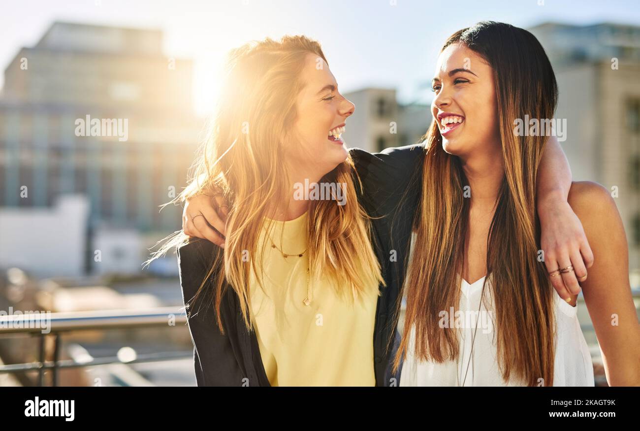 Shes the funniest. young female friends spending the day outside. Stock Photo