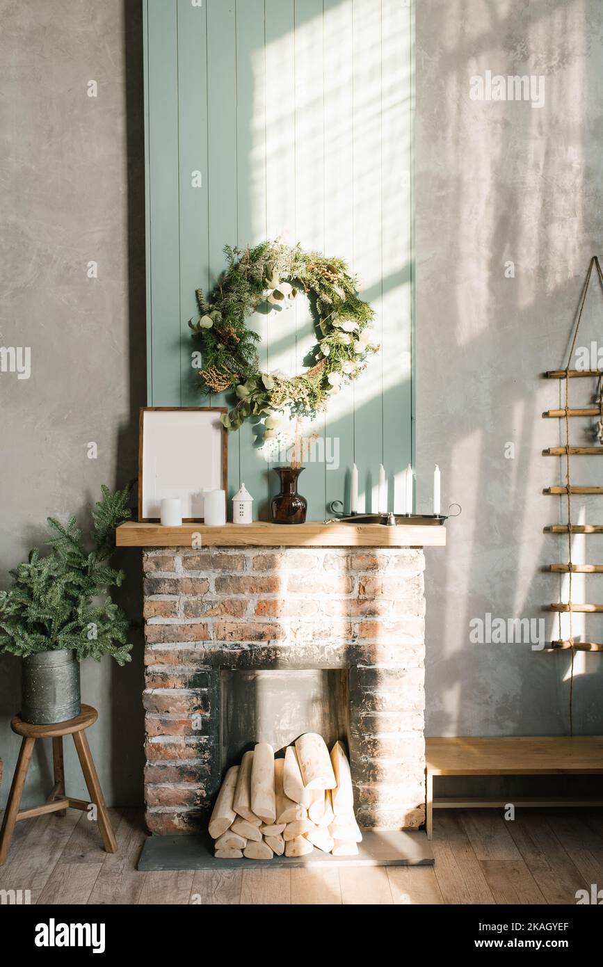Modern Christmas interior with decorative brick fireplace, Scandinavian style Stock Photo