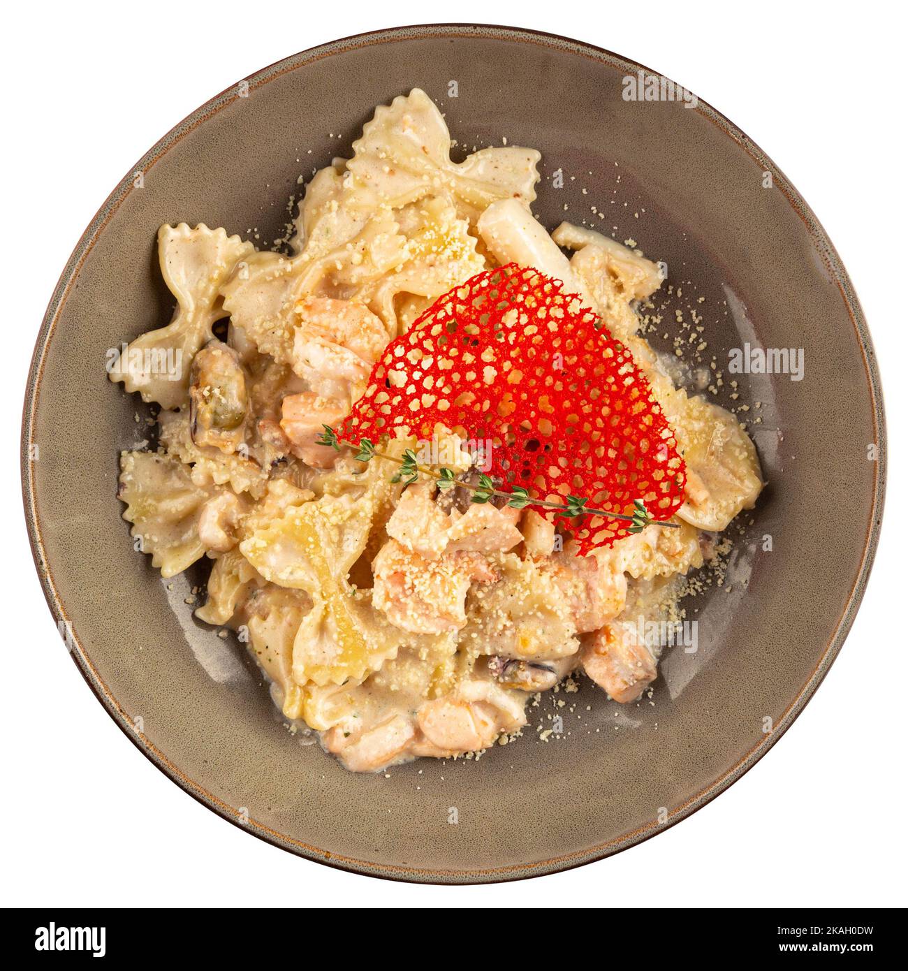 Portion of gourmet farfalle creamy salmon pasta Stock Photo