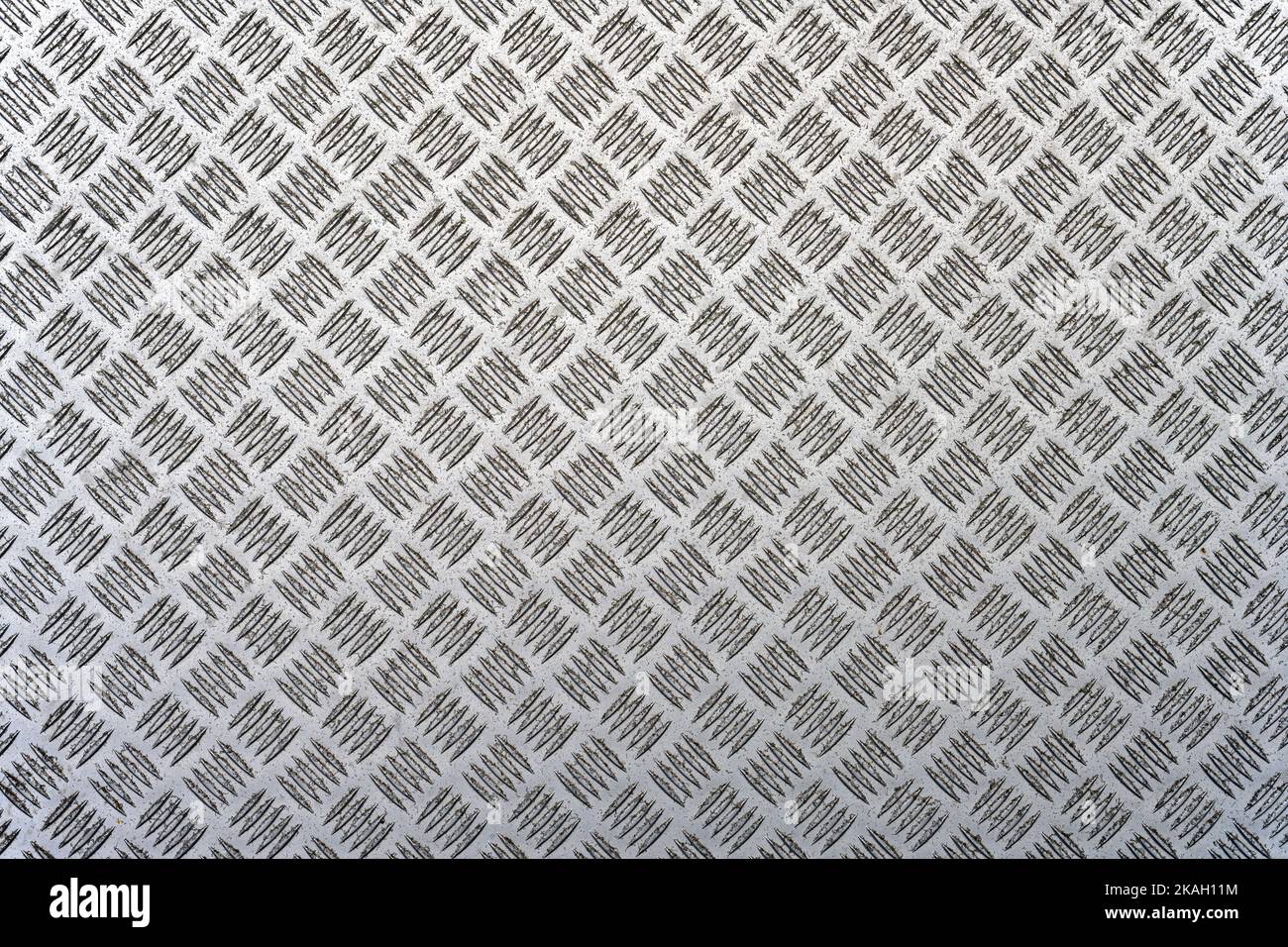 A metal background with a tread plate pattern Stock Photo