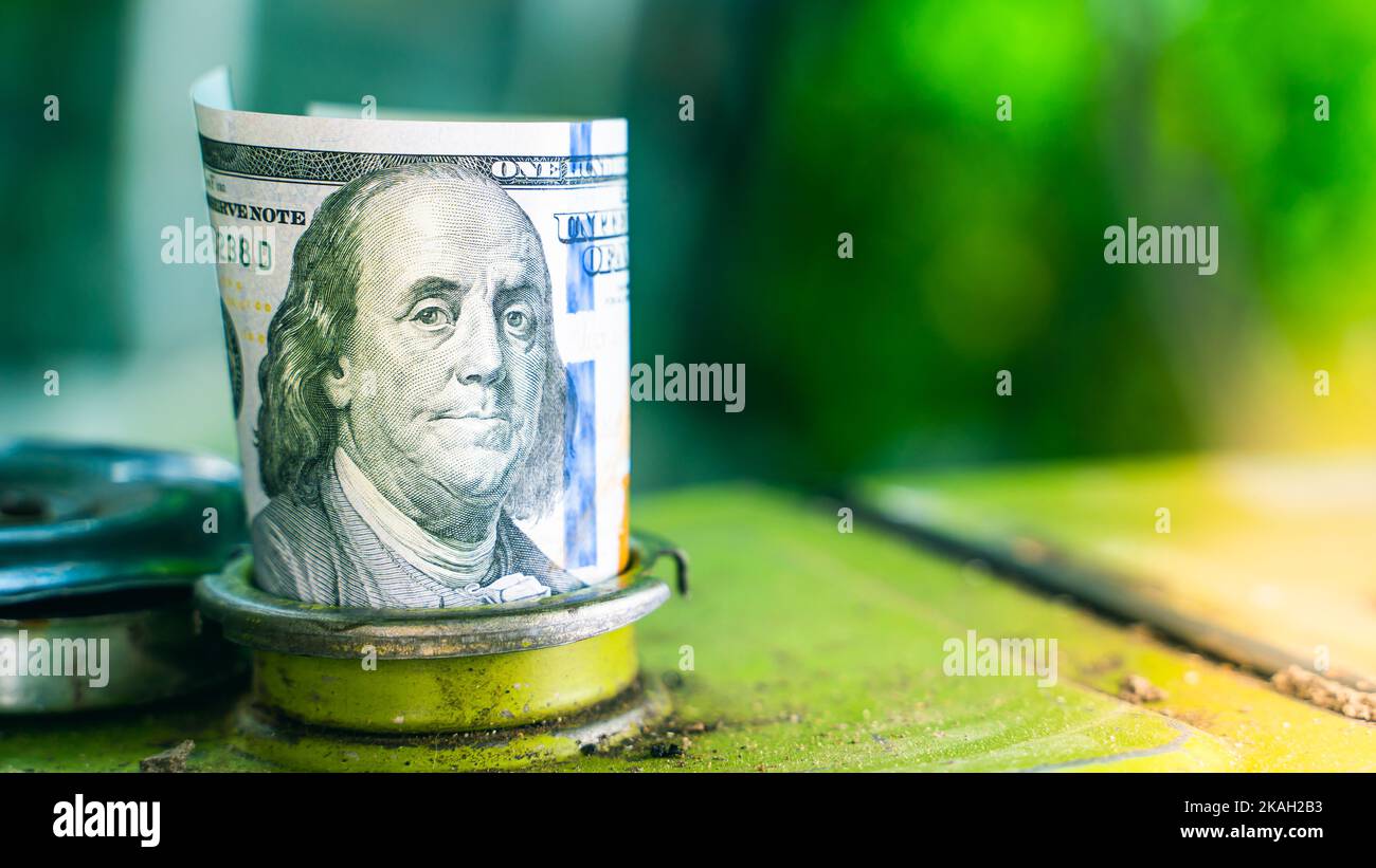 One Hundred Us Dollars In The Filler Neck Of A Gas Tank Close up On A today-currency-exchange-rate-usd-to-inr-on-aug-15-2020