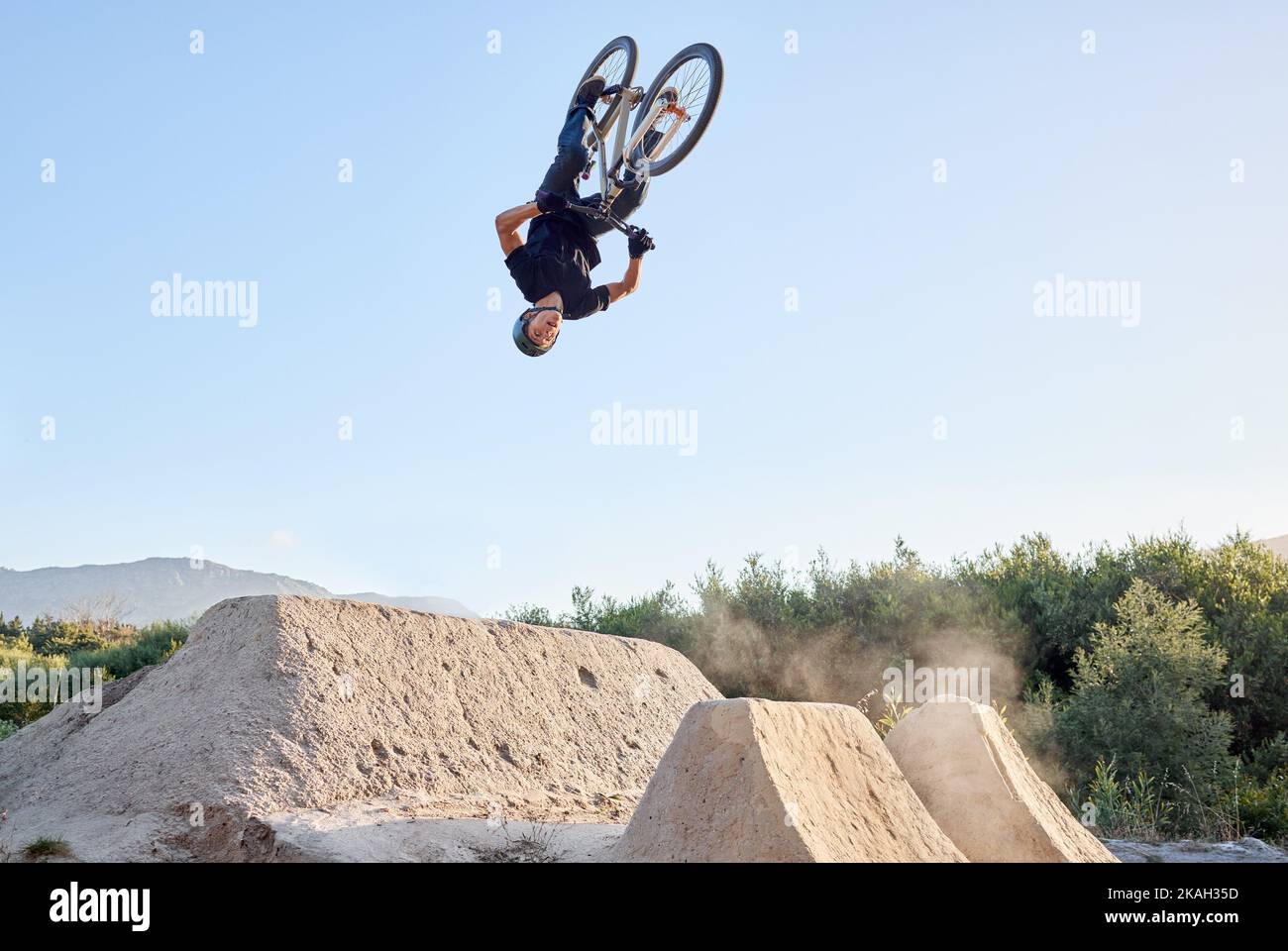 Bike, nature and outdoor sports while biking doing dangerous jump in ...